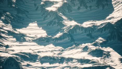 aerial view of the alps mountains in snow