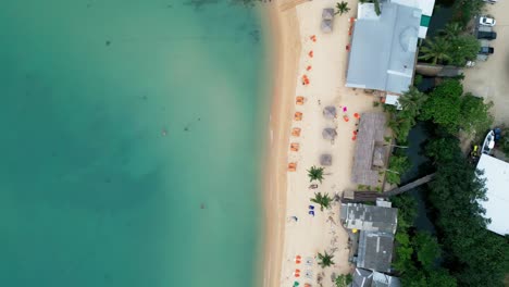 aerial top down descending on mae nam beach on koh samui, thailand, showcasing turquoise waters, sandy shorelines, and tropical surroundings