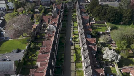 straight-down aerial of vicars’ close displaying parallel medieval terraces, stone chimneys and green verge exemplifying europe’s oldest intact residential street
