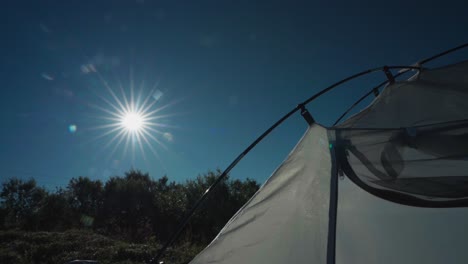 camper tent on a peaceful sunset in the wild