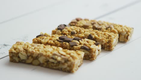 granola bars with dried fruits wooden background