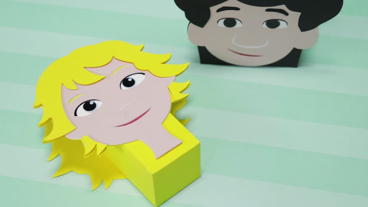 Child-themed cardboard candy boxes with face illustrations