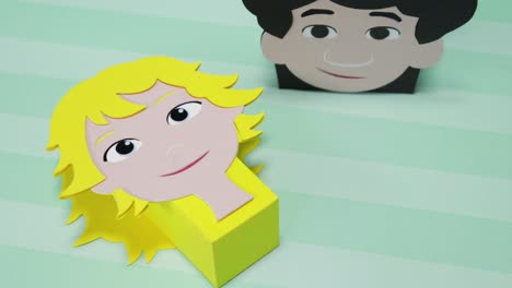child-themed cardboard candy boxes with face illustrations