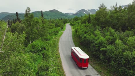 Anchorage-Trolley-Tour-Traveling-Through-Dense-Green-Forest-In-Alaska