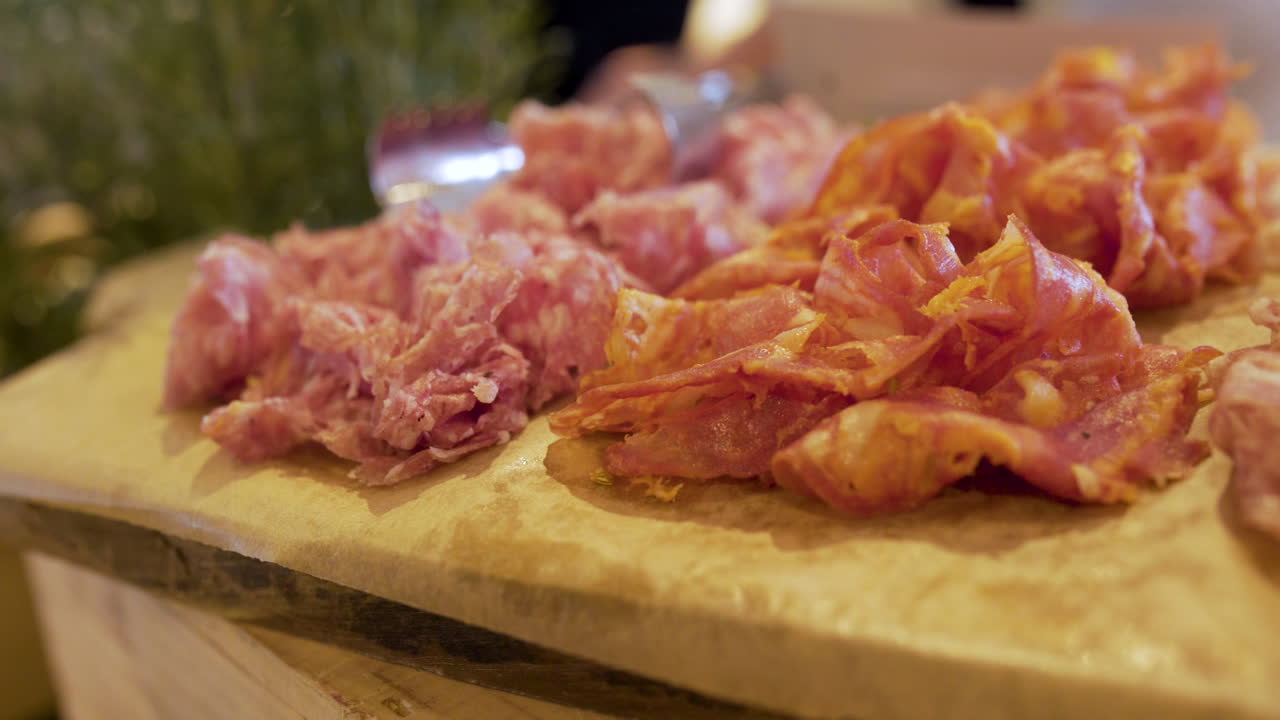 Close Up Of Fresh Italian Style Hams On Wooden Board