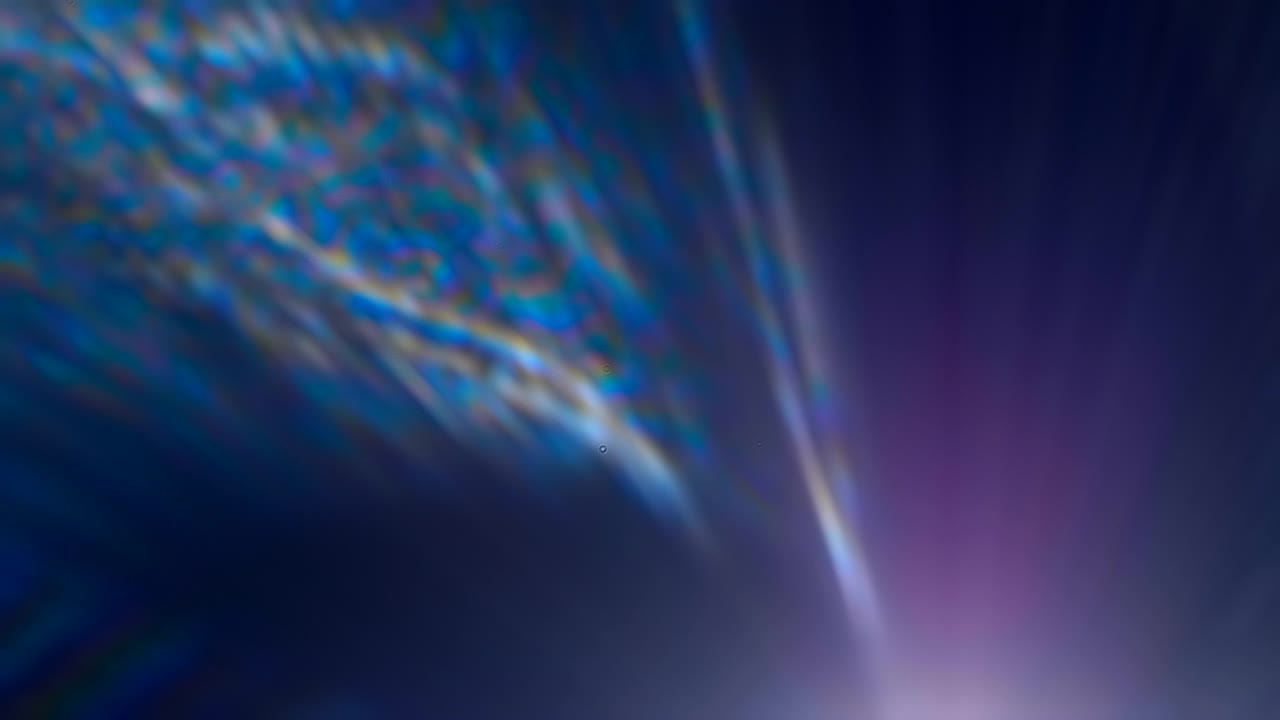 Colorful flares in lens from a bright light source on a black background