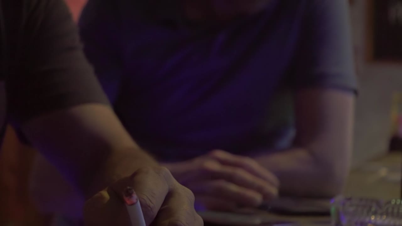 People sitting at night bar