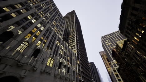 skyscrapers illuminated at twilight in a bustling urban area