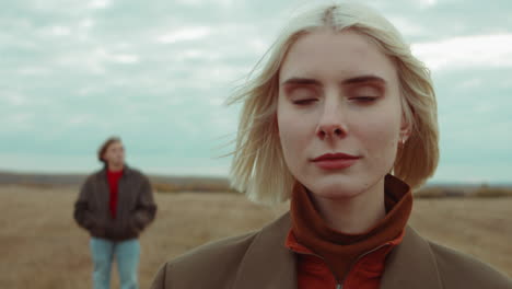 portrait of beautiful woman on autumn field