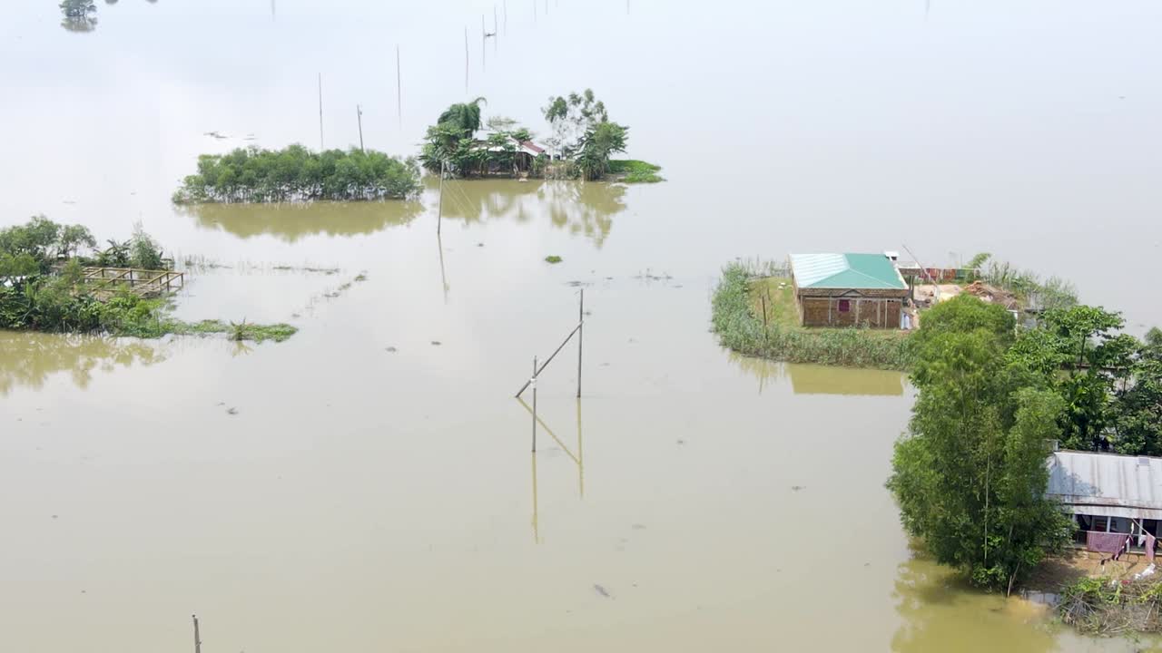 Aerial view of flooded village in Bangladesh. Homes submerged by flood water