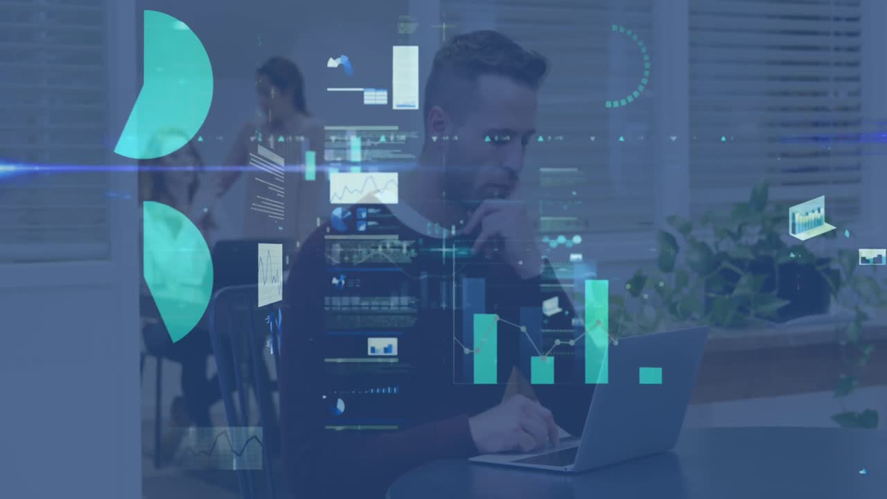 un hombre de negocios trabajando en una computadora portátil en una oficina moderna