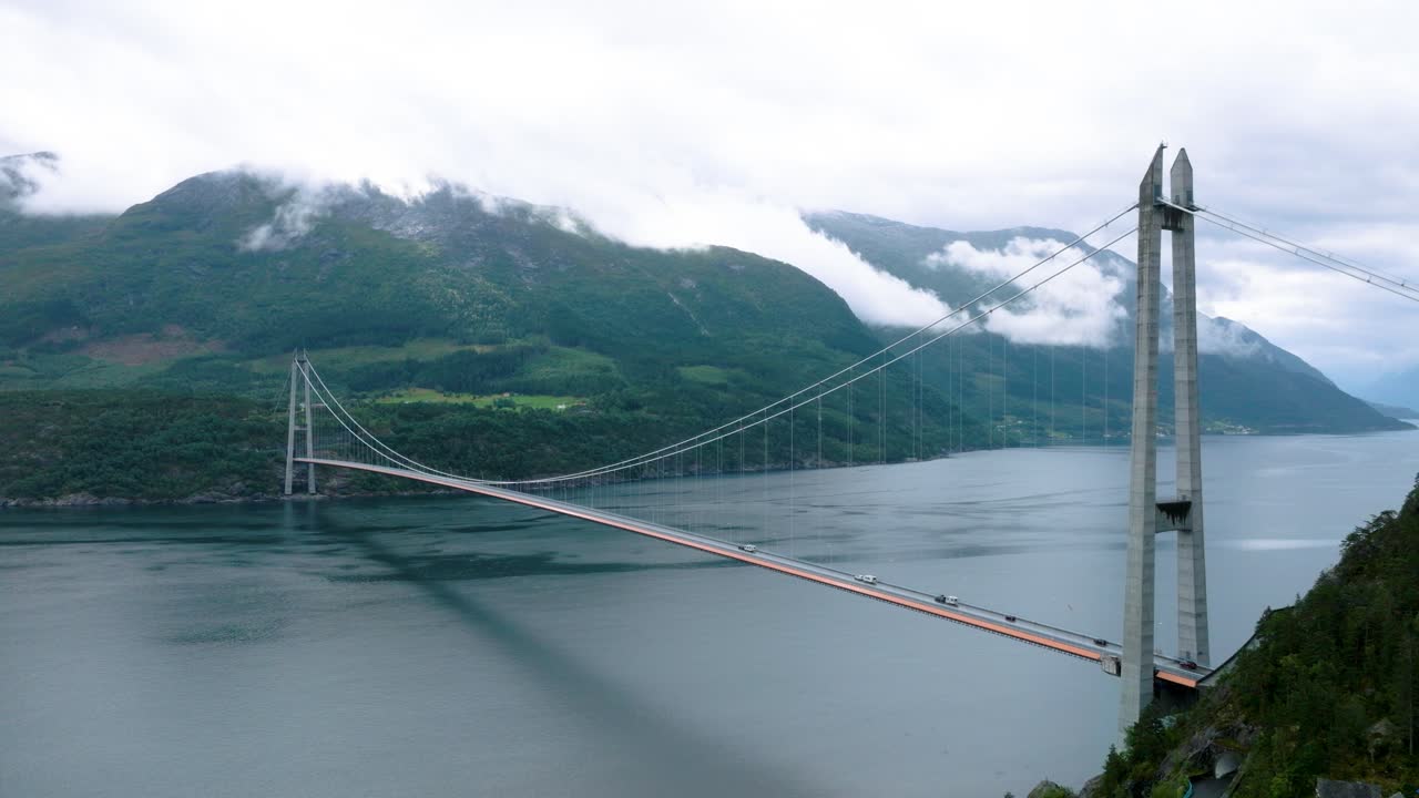 Drone ascend of Hardanger bridge Norway on cloudy day
