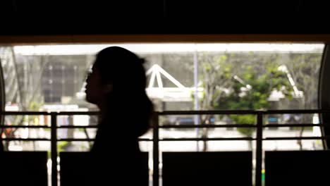 pedestrian silhouettes on footbridge