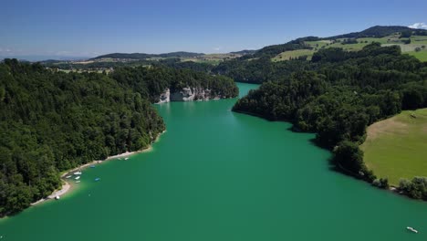 Greyerzersee Lake Gruyère Switzerland aerial drone artificial man-made turquoise blue water