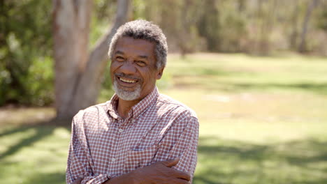 Middle-aged-African-American-man-in-countryside-walks-into-focus