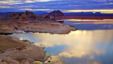 A majestic drone view soaring over the striking desert landscape and red rock formations near Lake Powell.