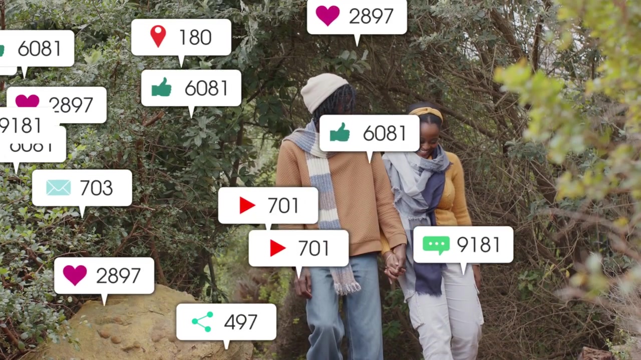 Couple walking trail, icons appearing left, expanding around faces, showing social media engagement