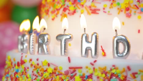 cake with colorful happy birthday candles