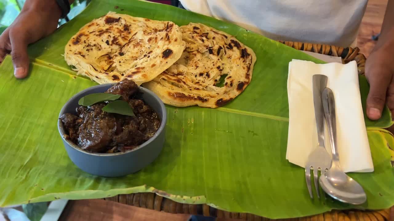 Mutton olathede, a south Indian delicacy served with Malabar paratha