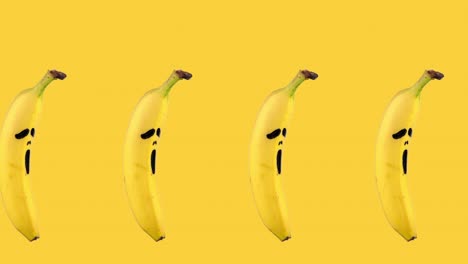 seamless looping animation of one row of bananas with painted on them scary mask of fear on a yellow background. halloween concept with copy space