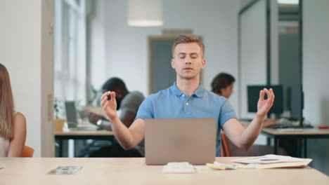 tired business man relaxing after work. exhausted man making yoga exercise