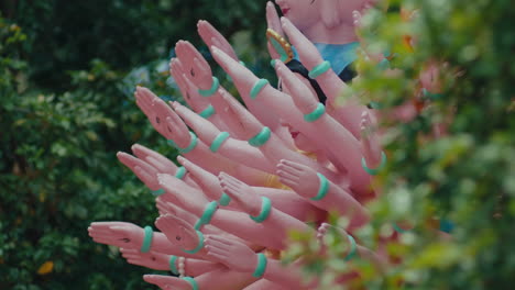 the multi-armed buddha statue lies outside in the cool weather