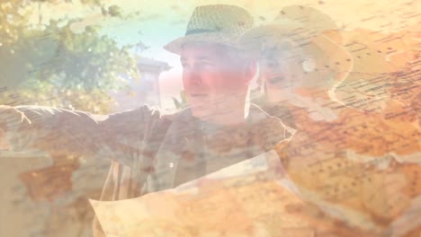 Animation-of-glowing-light-over-senior-couple-reading-map-in-nature