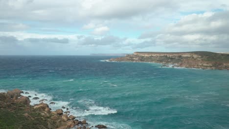 AERIAL:-Ghajn-Tuffieha-Bay-with-Beautiful-Turquoise-Colour-Sea-Water-on-a-Sunny-Day