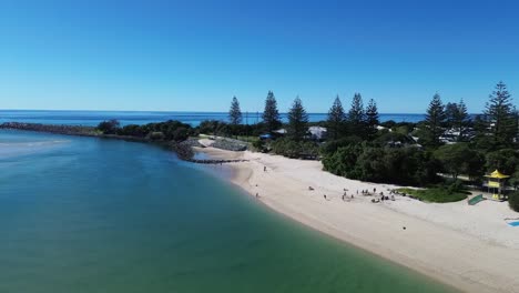 stunning drone videoof tallebudgera river, capturing torquoise calm water and holidaiers enjoing a wonderful sunny day