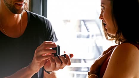 Man-proposing-woman-by-giving-her-a-engagement-ring