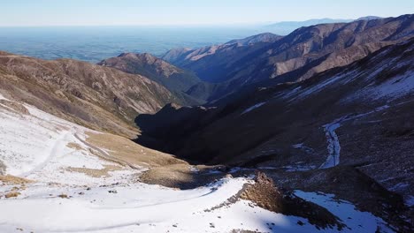 Aerial-shot-flying-over-Mount-Hutt,-a-snow-capped-mountain-range,-New-Zealand