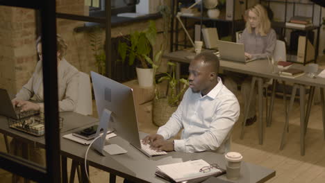 top view of american man and women employees working in the office