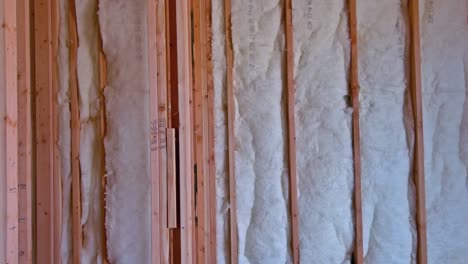 insulating rock wool insulation in wooden frame for future walls for cold barrier