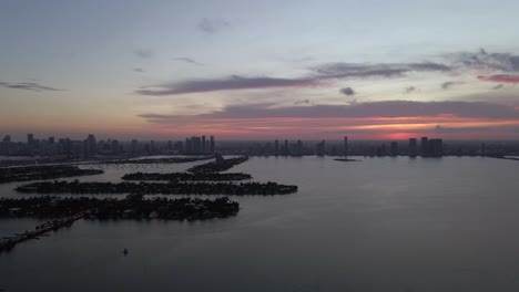 sunset pan across biscayne from venetian islands to tuttle causeway