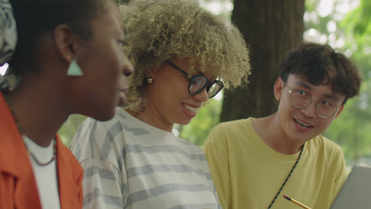 High School Friends Studying with Laptop in Park