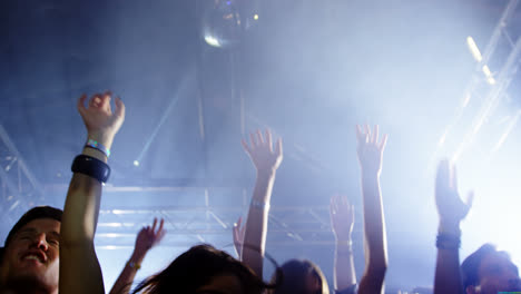 group of people dancing at a concert 4k