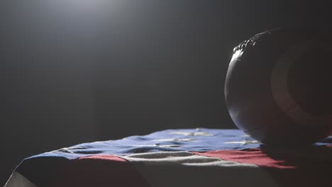 close up studio shot of american football on stars and stripes flag 6