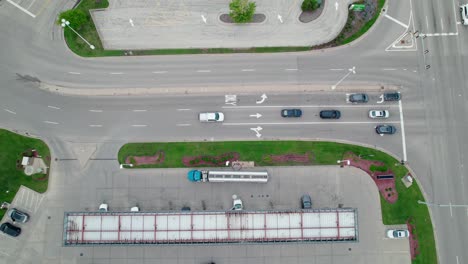 zooming-on-a-Tanker-semi-truck-that-unloads-fuel-at-gas-station-in-america