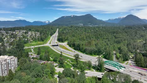 Vehicles-Driving-On-Trans-Canada-Highway-At-Daytime-From-Lynnmour,-North-Vancouver,-BC,-Canada