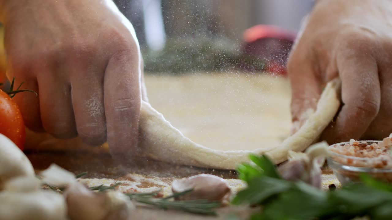 Preparing pizza dough with fresh ingredients
