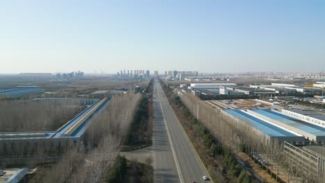 aerial shot revealing industrial area with chinese factories in the outskirts of linyi, shandong province, china