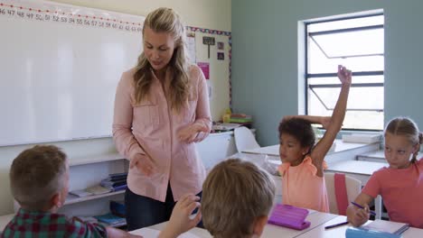 female teacher teaching kids in the class