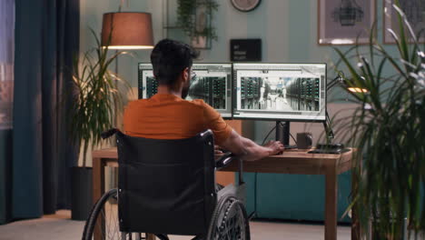 man in a wheelchair working on computer design