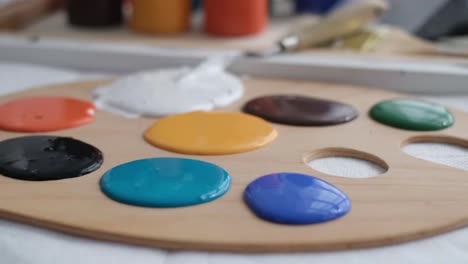 close up of a professional artist mixing a palette of paints for painting - close up of a professional artist mixing a palette of paints for painting. creativity concept. video