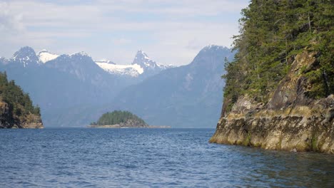 wide view of a large mountain peak from a boat on the ocean