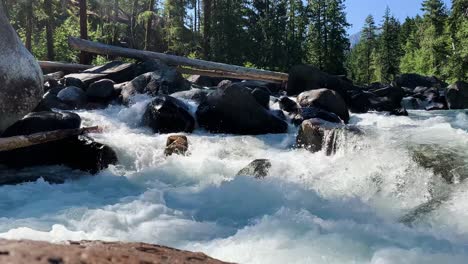 low angle static shot of whitewater rapids on icicle creek, washington state