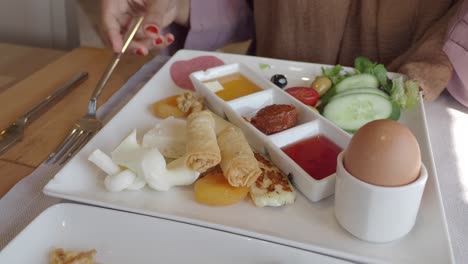 woman eating a turkish breakfast