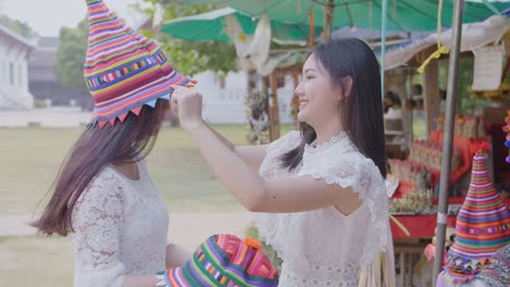 happy friends enjoying holiday with hat, slow motion