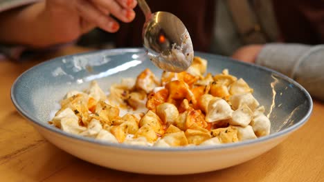 woman eating manti