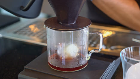 pouring hot water for dripping arabica coffee